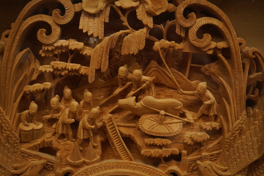 A pair of early 20th century, finely carved Chinese sandalwood photo frames, 30.5cmx24cm oval. Condition - good